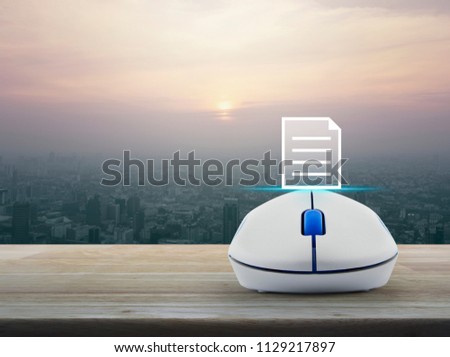 Document icon with wireless computer mouse on wooden table over modern city tower at sunset, vintage style, Business communication concept
