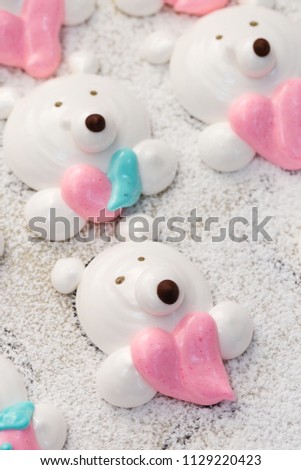 Cute bear faces marshmallow on baking tray. Cooking funny food with cartoon character. Handmade pastry concept