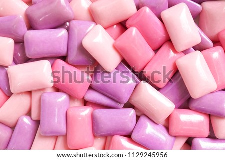 gum. colorful confectionary background of candy gums in different shades of pink and purple. Royalty-Free Stock Photo #1129245956