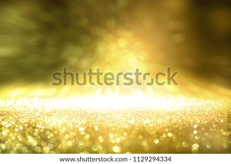glitter vintage lights background. golden and white. de-focused