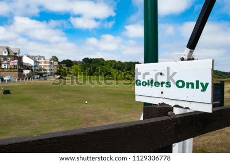 "Golfers Only" Sign Next To Green At Golf Club