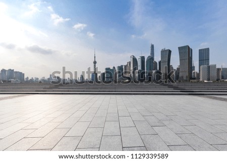 Panoramic skyline and modern business office buildings with empty road,empty concrete square floor
