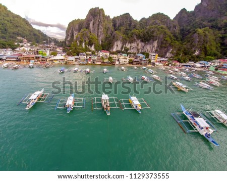 Aerial view of the beach with fishing boats. El Nido, Philippines, 2018.