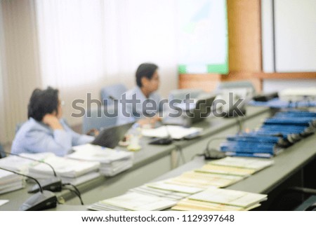 Blur background of Business and Investment presentation. Presenter and audience at the conference room. Blur employees Young colleagues sitting at the business meeting in the office.
