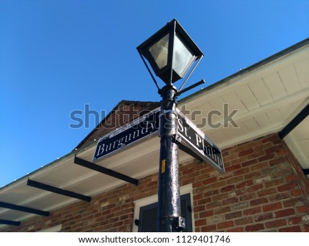 Traditional, classical, beautiful streetlight in New Orleans, Louisiana, the United States of America. The streetlight is located at the intersection between the streets St. Philip and Burgundy. 