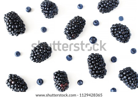 Styled stock photo. Summer healthy fruit composition with juicy blackberries and blueberries isolated on white table background. Food pattern. Empty space. Closeup Flat lay, top view.