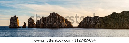 Panorama of Cabo San Lucas, the most famous travel destination in Baja California.

Rock formations close to the shores of Cabo San Lucas at sunset.