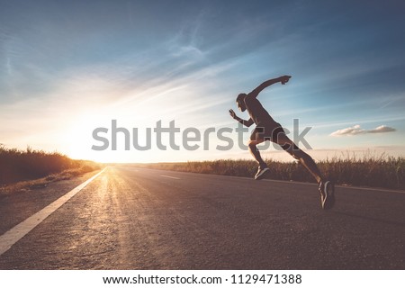 The man with runner on the street be running for exercise. Royalty-Free Stock Photo #1129471388