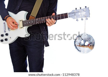 Close portrait of rock artist posing in studio with guitar