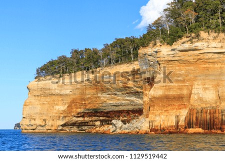 Sandstone cliffs on the shoreline of Lake Superior in Pictured Rocks National Lakeshore, Michigan, USA