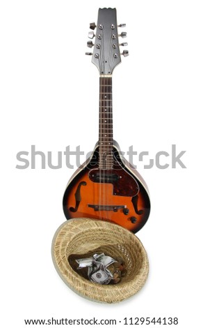 Mandolin and other things of a strolling musician on a white background