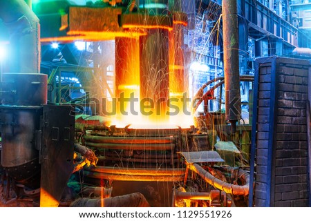 Working electroarc furnace at the metallurgical plant workshop Royalty-Free Stock Photo #1129551926