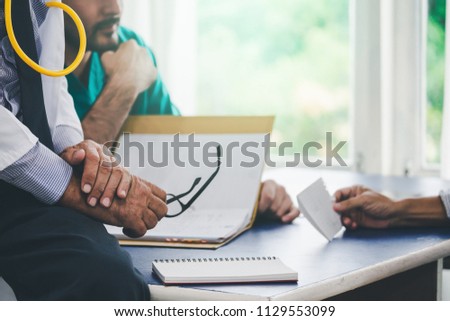 Doctor and surgeon discussing with patient in hospital room, Healthcare and medical concept