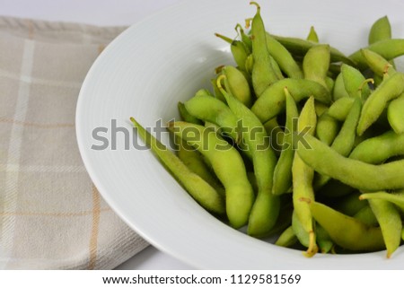 Soy beans in a white bowl