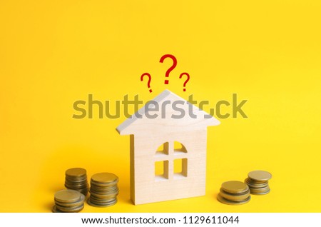 wooden house and question mark. review of the house, the best offer of purchase. Buying, selling and renting a real estate. Loan for an apartment, mortgage rate. Affordable housing for young families.