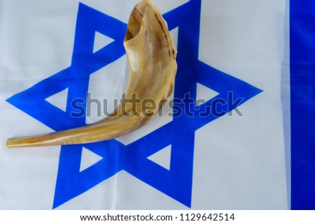 Shofar horn on Israel flag. Shofar - Yom Kippur, Day of Atonement and Rosh Hashanah Jewish holidays symbol.  