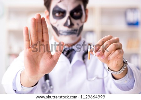 Scary monster doctor working in lab Royalty-Free Stock Photo #1129664999