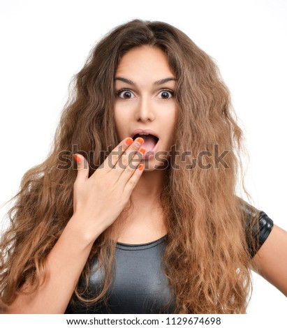 Curly brunette woman happy laughing excited looking up with closed eyes isolated on white background