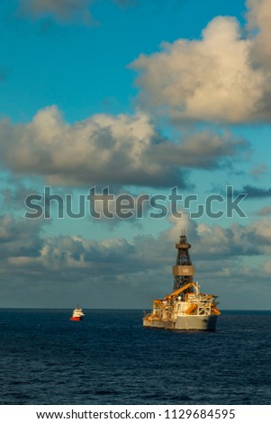 Beautiful day in the oil towers and offshore oil rigs, beautiful clouds, sea and sky 