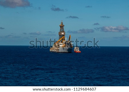 Beautiful day in the oil towers and offshore oil rigs, beautiful clouds, sea and sky 