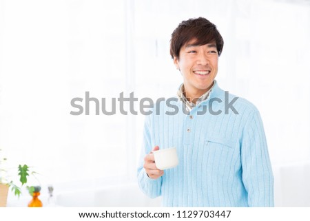 Asian middle age man who drink coffee
