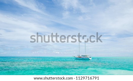 Summer concept , Boat sailing on turquoise sea color at maldives on the weekend holidays