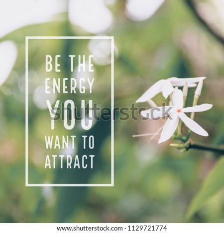 Inspirational motivational quote "be the energy you want to attract." with white flowers background. Royalty-Free Stock Photo #1129721774
