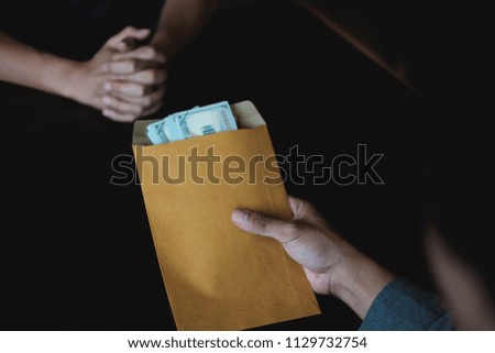 Business Man Rejecting black money in envelope that offered by contractor for permit in contract. Corruption and Anti Bribery concepts.