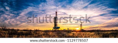 Drilling Rig Sunset Panorama Royalty-Free Stock Photo #1129778507