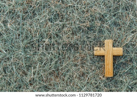 Wooden Christian cross on grass. Wooden Christian cross background. Christianity Concept. Faith hope love concept