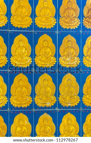 Vintage tiled wall with Buddha