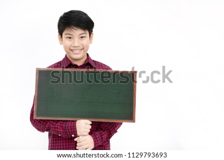 Portrait of asian cute boy age 10 years hand holding green blank board isolated on white background.
