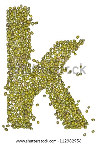 alphabet form green beans on white.