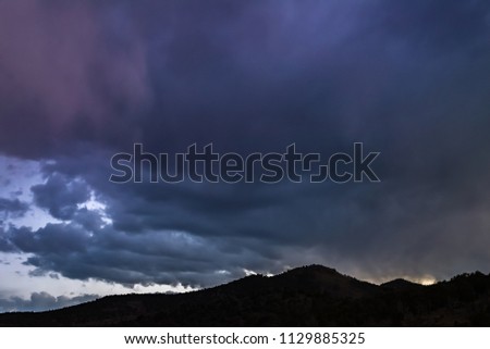 USA, Nevada, Nye County, White Pine Range, Currant Summit. A colorful cloudy sky during blue hour shortly after sunset.
