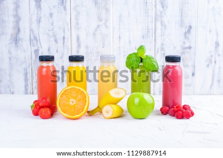Organic cold-pressed raw vegetable juices in glass bottles. Vitamin and healthy food. Copy space. Royalty-Free Stock Photo #1129887914
