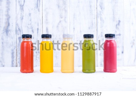 Organic cold-pressed raw vegetable juices in glass bottles. Vitamin and healthy food. Copy space., Royalty-Free Stock Photo #1129887917