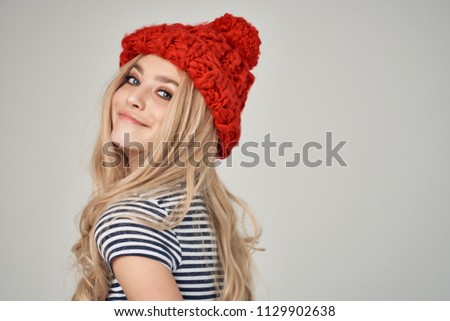 stylish blonde knitted hat turned head back                           