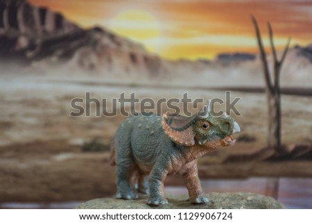 Cute baby triceratops on jurassic era