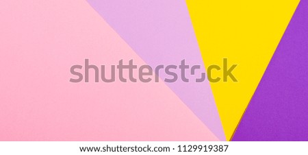 Color papers geometry flat composition background with violet, purple, pink, yellow tones.
