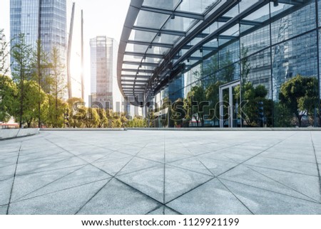 The road under the background of modern urban architecture