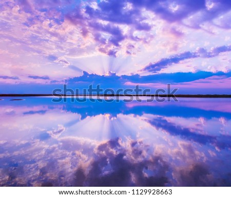 Beautiful scenery with colorful sky, beautiful water reflectioncloud, clouds and sunbeams.Artistic picture. Beauty world.