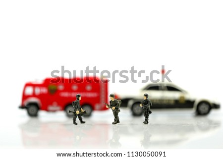 Miniature people : Soldier team with fire engine and police car.