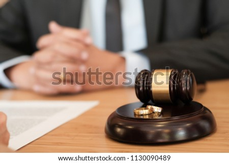 Judge gavel deciding on marriage divorce signing papers. lawyer concept