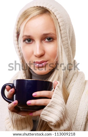 Young woman with a cup of hot drink, isolated on white background