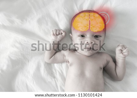 Asian born Little Baby on white cotton.Sick baby, pale picture and Red circle showing sickness
(brain)
