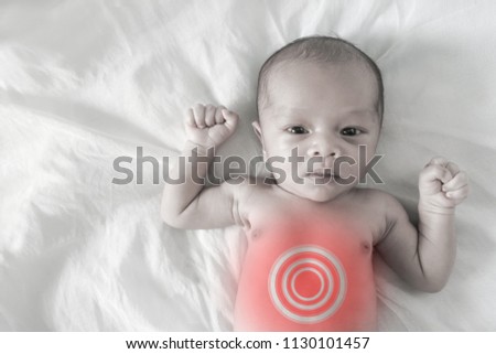 Asian born Little Baby on white cotton.Sick baby, pale picture and Red circle showing sickness
(internal organs)