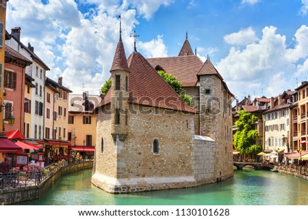  
Medieval castle on the canal in the French city of Annecy resort. Department of Upper Savoy. France. Royalty-Free Stock Photo #1130101628