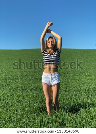 girl in a green field