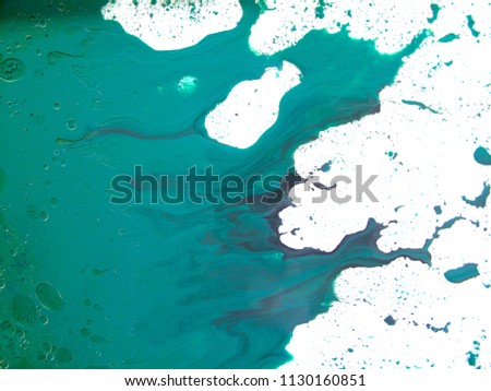 abstract art background.oil and water.Free movement of bright colors.