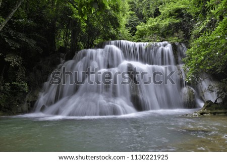 Huay Mae Khamin waterfalls in deep forest at Srinakarin National Park ,Kanchanaburi ,A beautiful stream water famous rainforest waterfall in Thailand.